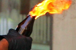 BJP functionary hurls petrol bomb on his own house