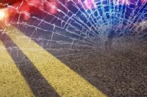 Truck overturns to avoid crashing car