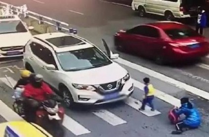 Little boy kicks car after it hits his mother on road Video Viral