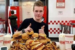 WATCH VIDEO: Man Vs Food - 22-Year-Old Eats Entire Restaurant Menu in Just 61 Minutes!