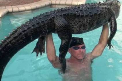 man rescues 9-foot-long \'real mellow\' alligator from pool: Phot