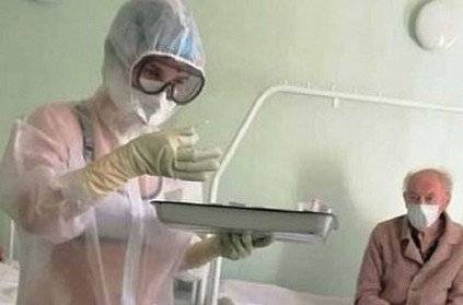 Russian Nurse turns up to work in swimsuit with PPE Kit!