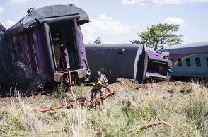 Train ploughs into truck, 14 dead, 190 injured
