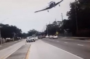 WATCH: Plane flies dangerously close to highway on Sunday