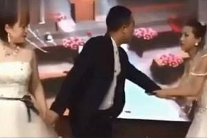Bizarre Video! Woman dressed in bridal gown crashes ex-boyfriend's wedding