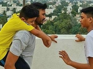 Actor Dhanush attends Ilayaraaja's concert with sons - Viral Pic!