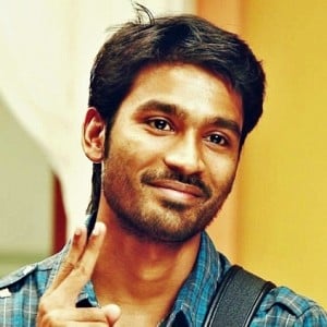 Who surprised Dhanush and made him happy?
