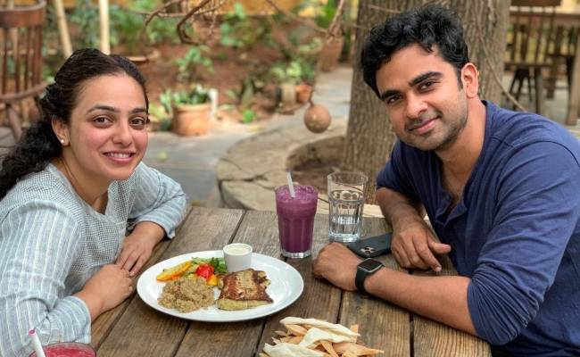Nithya Menen and Ashok Selvan chilling on the sets
