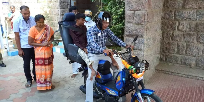madurai collector buys bike for disabled youth at his own expense
