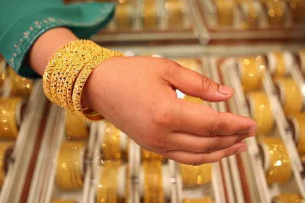 Yellow metal rises above Rs 45,100 per 10 grams; Silver trades flat