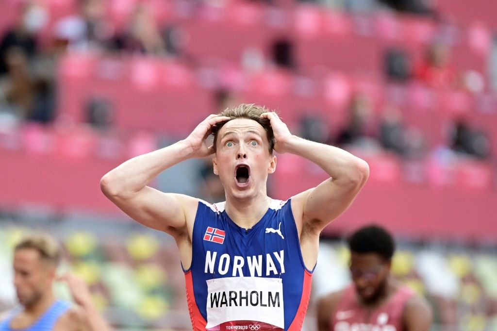 Norwegian athlete tearing his shirt in the excitement