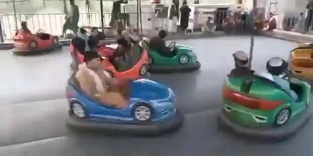 Armed Taliban Fighters Seen Riding Bumper Cars At Amusement Park