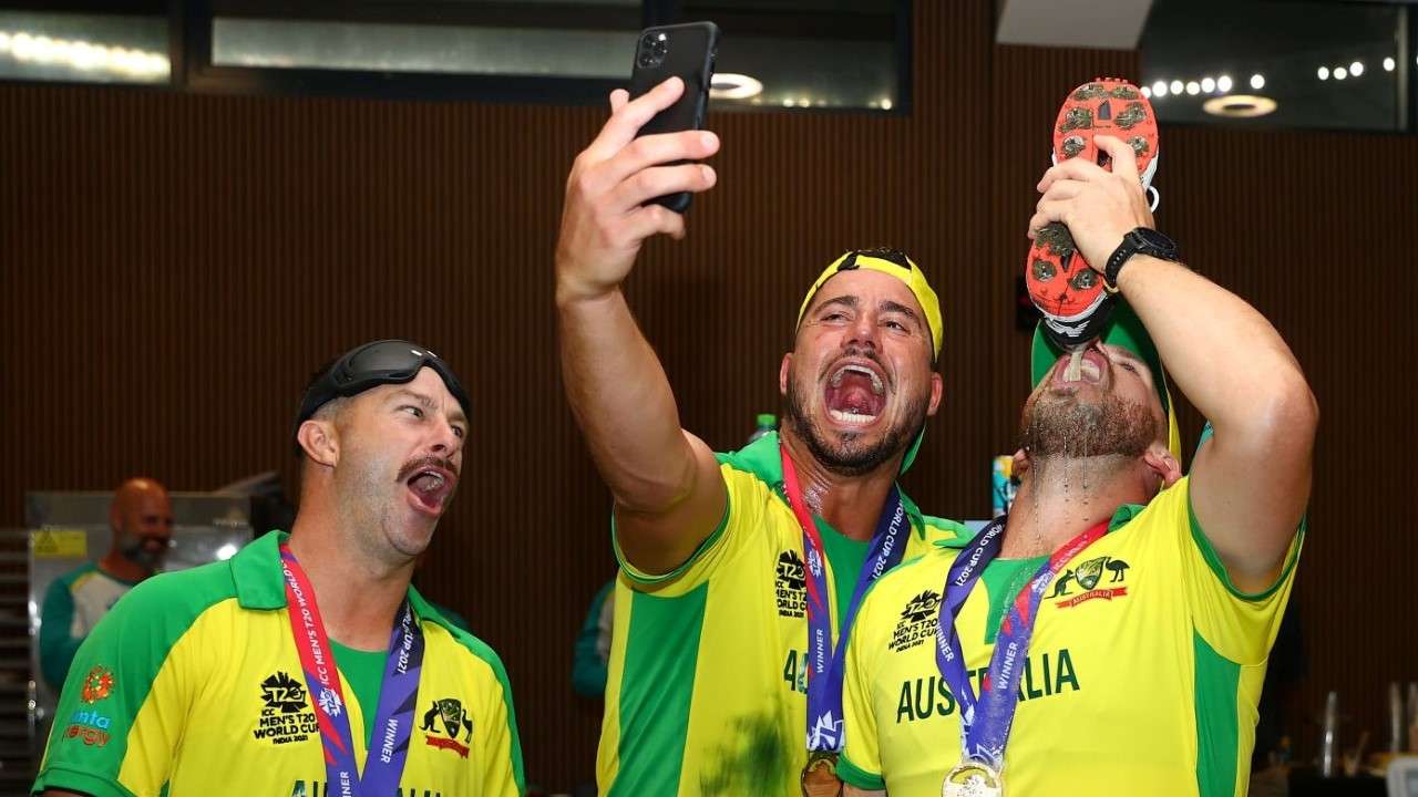 Australian team players drinking beer straight from shoe 