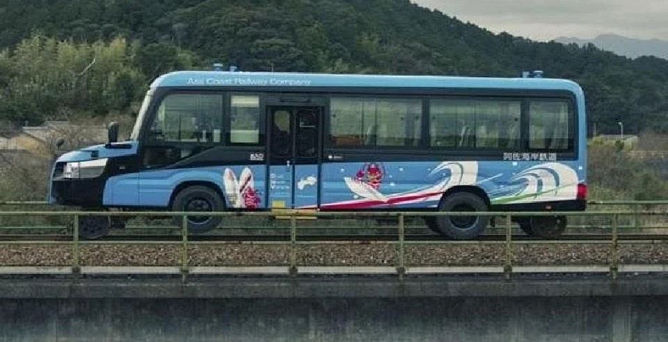 this DMV vehicle runs in roads as well as in rail tracks at japan