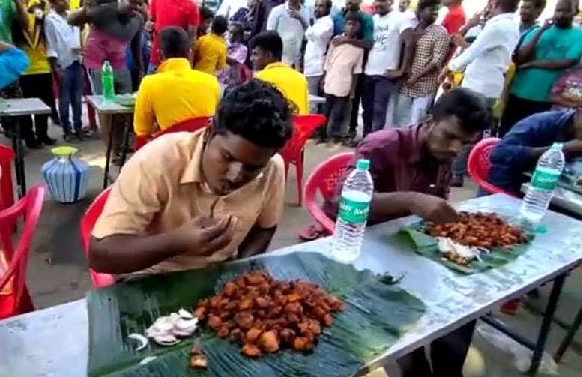 Villagers holding a chilli chicken competition on Pongal