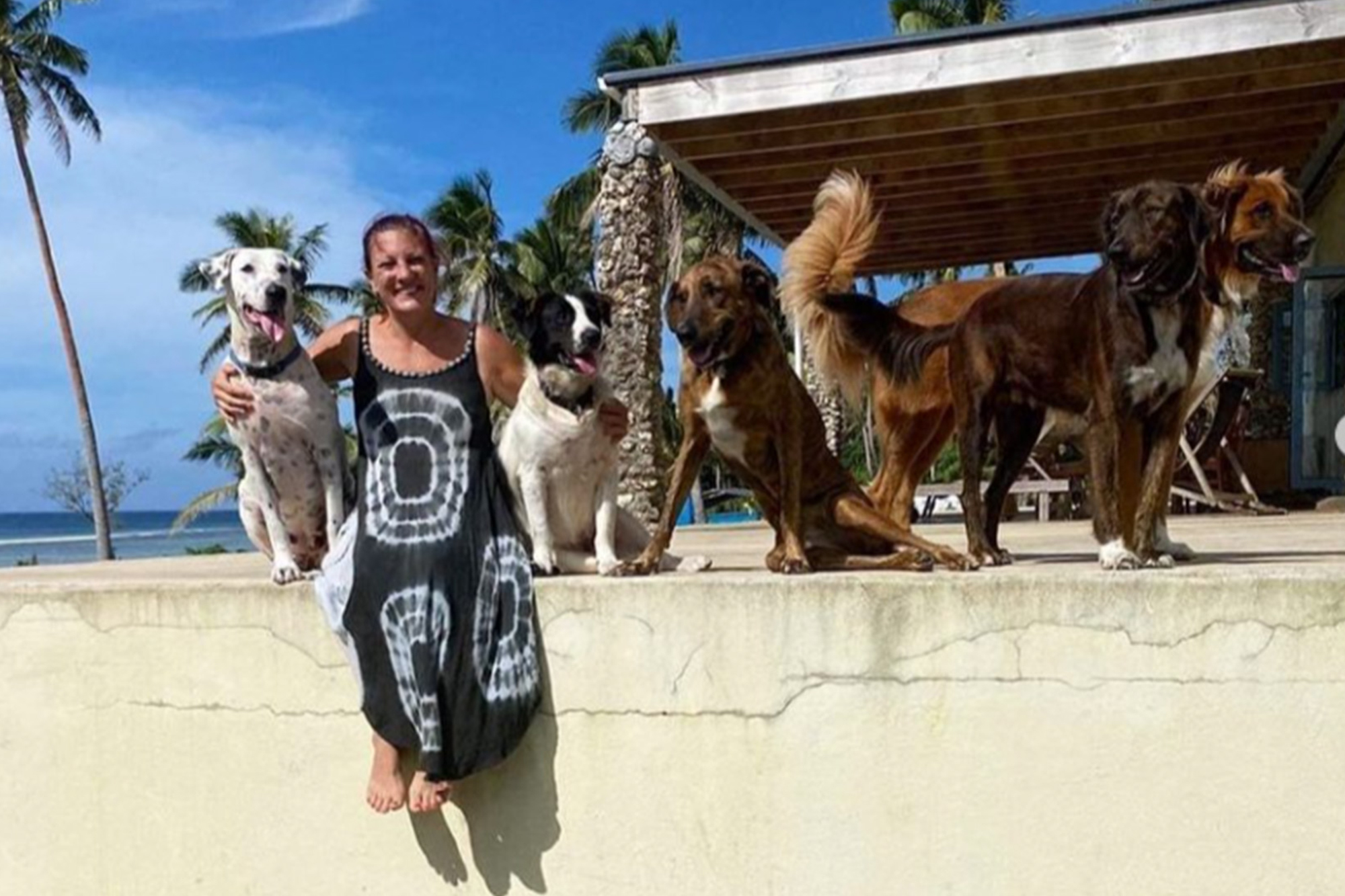 Woman save her dog during a Tonga volcanic eruption
