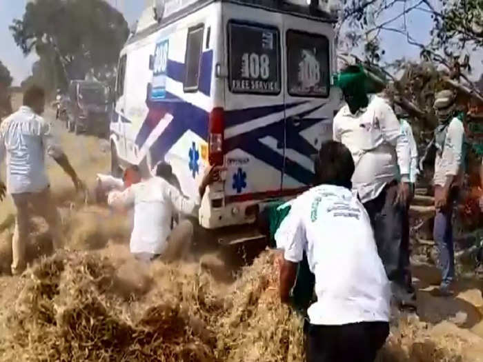 Pregnent carring ambulance stuck in stubble on the road