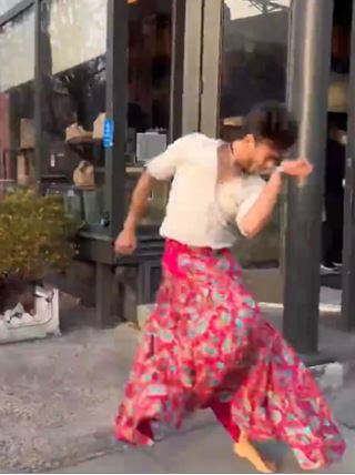Indian Man in skirt dances on New York streets