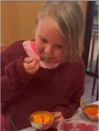 Little girl tries Indian food for the first time in Australia