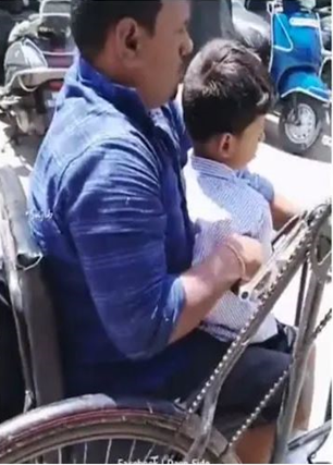 Specially abled father drops his children off to school in tricycle