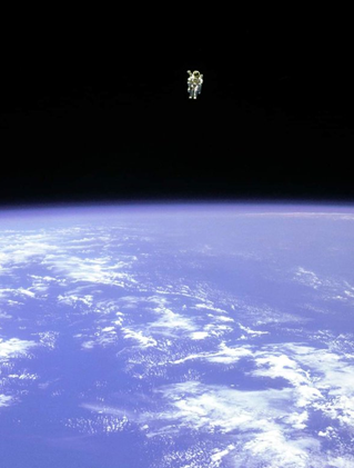 Astronaut floats in space away from safety of shuttle