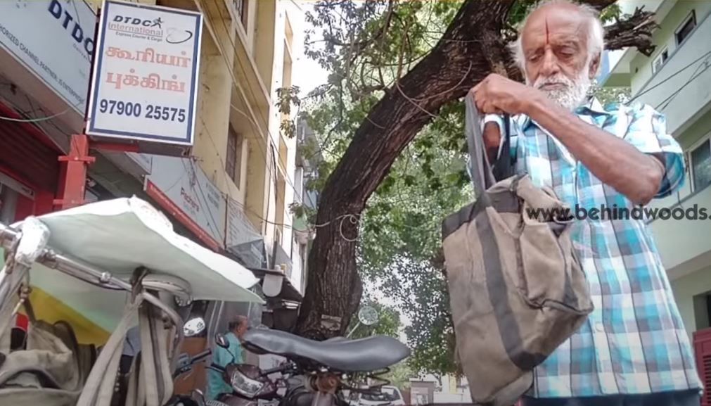 80 yr old man working as courier delivery guy with one hand