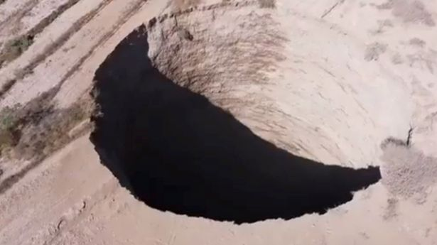 sinkhole tears open the ground in the chile copper mine