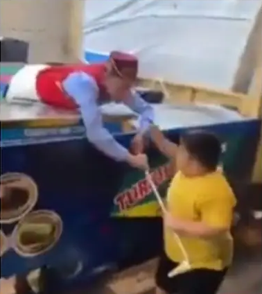 Little boy stuns Turkish ice cream seller during fun trick