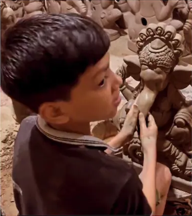 little boy making a sculpture of Lord Ganesha video