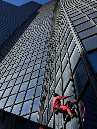 French Spiderman climbs Paris skyscraper to mark turning 60