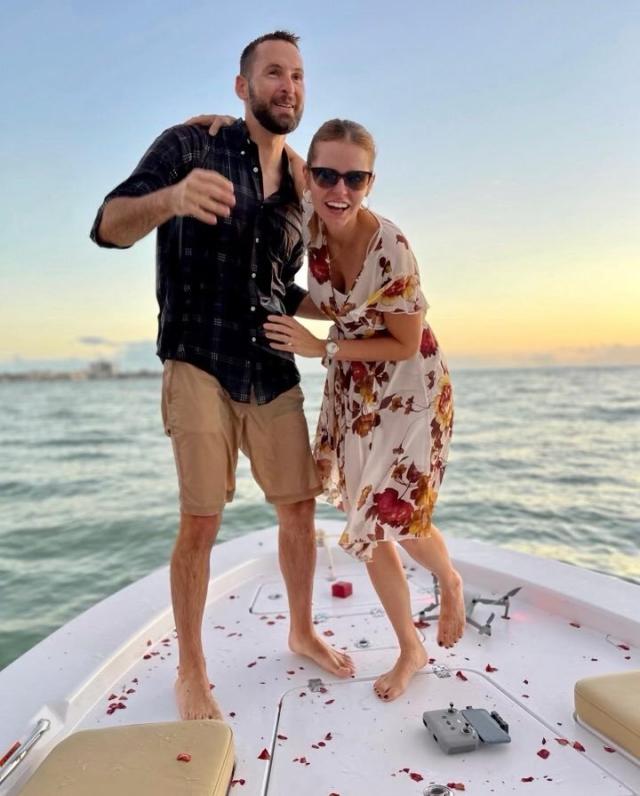 man tries to propose boat ring falls in water