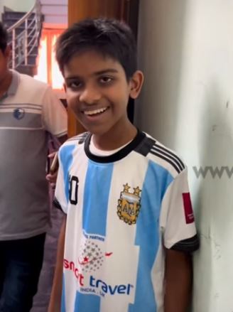 messi argentina little boy fan watch football match in qatar