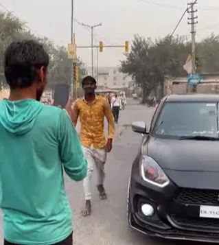 Two youth wanted to take photo with car owner helps them