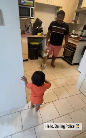 Child reaction after father try to hits mother in fun way